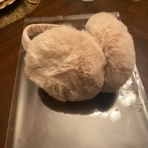 New in packaging. Beige faux fur ladies earmuffs. Perfect for the weather
